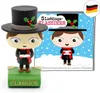 A product shot of a toy figure and a book cover, with a German flag in the corner. Produktbild-Vorschau