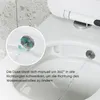 Close-up view of a toilet bidet nozzle with water spraying, with an inset circle showing a detailed view of the nozzle's movement and water flow. Anteprima dell’immagine prodotto