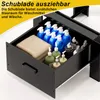 A black drawer unit for a washing machine, filled with laundry detergent bottles and towels. Produktbild-Vorschau