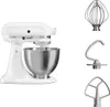 A white KitchenAid stand mixer with its bowl and three attachments displayed on a white background. Produktbild-Vorschau