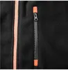 A close-up view of a black fleece sweatshirt, showing a zipper pocket and a main zipper. Podgląd zdjęcia produktu