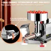 A close-up marketing image of an electric tomato press, highlighting its juice and pulp separation features with strawberries in the hopper and juice dripping into small dishes. Produktbild-Vorschau