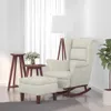 A cream-colored rocking chair with an ottoman is placed in a room with sheer curtains and a floor lamp. Náhled obrázku produktu