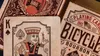 A close-up view of a Bicycle Bourbon playing card deck, showing the King of Spades card and the deck's packaging. Náhľad obrázku produktu