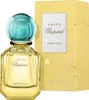 A bottle of Chopard Happy Lemon Dulci Eau de Parfum and its packaging are displayed against a white background. Voir les images du produit