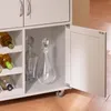 A close-up view of a kitchen cart with wine bottles and decanters. Voir les images du produit