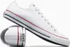 A pair of white Converse sneakers are shown against a white background. One shoe is placed upright, while the other is folded and placed behind it. Voir les images du produit