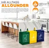 A modern kitchen interior with a kitchen island and bar stools, featuring three colorful recycling bags in the foreground. Produktbild-Vorschau