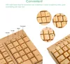 A close-up view of a wooden keyboard with several circular insets showing details of the keys. Produktbild-Vorschau