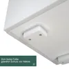 A close-up view of the underside of a white cabinet, showing its feet. Anteprima dell’immagine prodotto