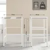 Two white metal shelving units are shown with dimensions indicated by dotted lines and text. Produktbild-Vorschau