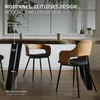 A dining table with modern chairs in a well-lit room. Náhľad obrázku produktu