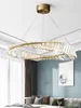 A modern living room with a large, ornate chandelier. Anteprima dell’immagine prodotto