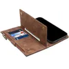 A brown leather wallet-style phone case is open, showing credit cards and a bill inserted, with a smartphone placed inside. Produktbild-Vorschau