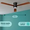 A ceiling fan with wooden blades installed on a ceiling above a teal wall. Náhled obrázku produktu