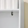 A close-up view of a white shelf with a metal bracket attached to its underside. Produktbild-Vorschau