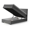 A dark gray boxspring bed with its storage compartment open, revealing the mattress and internal storage space. The bed is shown from a diagonal angle against a white background. Produktbild-Vorschau
