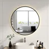 A modern bathroom with a sink, faucet, and a round LED mirror reflecting a bathtub and a window. Podgląd zdjęcia produktu