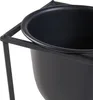 A close-up view of a black metal plant stand holding a black pot. Náhled obrázku produktu
