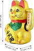 A golden Maneki Neko cat figurine with red and green accents, holding a fan and a scroll. Dimensions are indicated with measurement lines and text. Produktbild-Vorschau