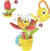 A Yookidoo Pop-Up-Badespielzeug "Schnecke und Blumengarten" toy is shown with numbered steps illustrating how to use it. Podgląd zdjęcia produktu