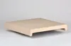 A beige cushion with a curved edge, shown from a side angle on a light gray background. Anteprima dell’immagine prodotto