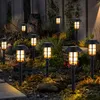 Solar-powered garden lights illuminating a garden path at dusk. Produktbild-Vorschau
