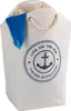 A white laundry bag with a nautical-themed graphic and a blue towel sticking out. Produktbild-Vorschau