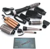 A collection of hair styling attachments and a hair dryer base are laid out on a white background, along with a product box. Anteprima dell’immagine prodotto