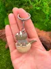 Onwomania - Dinosaure Triceratops dans un oeuf - Porte-clés Voir les images du produit 3