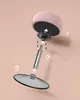 An exploded view diagram showing the assembly of a pink stool. Náhled obrázku produktu