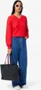 A woman is posing with a tote bag. Anteprima dell’immagine prodotto