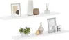 Two white floating shelves are displayed against a white background, each adorned with various decorative items. Produktbild-Vorschau