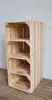A wooden shoe rack with four shelves against a plain wall. Produktbild-Vorschau