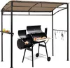 A black grill pavilion with a tan canopy, featuring a grill, shelves, and hanging hooks. Podgląd zdjęcia produktu