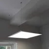 A square LED panel light is suspended from the ceiling by thin wires. Podgląd zdjęcia produktu
