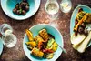 A table setting with grilled food and drinks. Produktbild-Vorschau