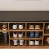A shoe organizer bench with various shoes on different shelves. Anteprima dell’immagine prodotto