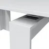 Close-up of the underside of a white table, showing a metal bracket mechanism. Náhled obrázku produktu