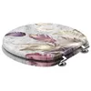 A toilet seat with a feather pattern. Produktbild-Vorschau