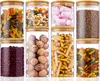 A collection of glass jars filled with various food items, arranged in two rows. Anteprima dell’immagine prodotto