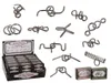 A collection of metal puzzles displayed on a white background, with a display box of puzzles in the foreground. Produktbild-Vorschau
