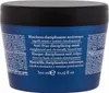 A close-up view of a dark blue hair mask jar with text on the label. Náhled obrázku produktu