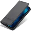 A black leather flip case for a smartphone is shown from a slightly elevated angle, with the flip cover partially open to reveal the phone screen. Produktbild-Vorschau