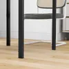 A close-up view of the legs of a black square dining table and a white chair with a cane back and gray seat, placed on a light wood floor. Podgląd zdjęcia produktu