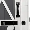 Close-up of a door handle and latch mechanism on a wooden cabinet. Anteprima dell’immagine prodotto