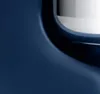 A close-up view of a blue kitchen appliance with a metallic interior. Podgląd zdjęcia produktu