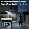 A security camera is shown monitoring a house at night, with a notification on a phone screen showing an intruder. Náhled obrázku produktu
