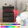 A bedside table with LED lights next to a bed, with a remote control and text overlays. Produktbild-Vorschau