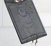 Water being poured onto a dark gray cutting board. Produktbild-Vorschau